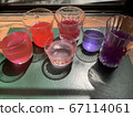 Glass of colorful water with light 67114061
