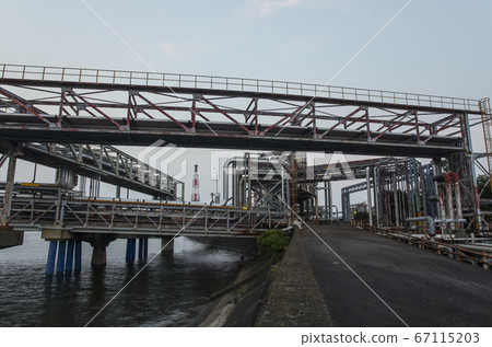 Industrial area with pipes 67115203