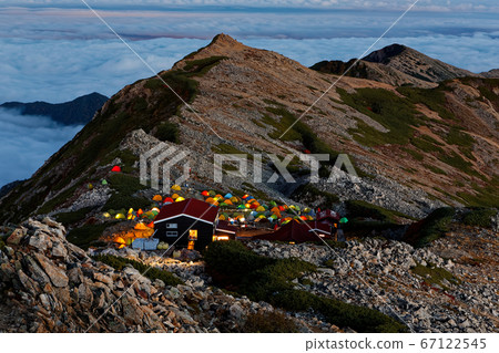Lights of the afterglow ridgeline and tent field from Mt. 67122545