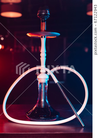 modern beautiful white shisha with a glass flask and a metal bowl with coals modern beautiful white shisha with a glass flask and a metal bowl with coals 67122943
