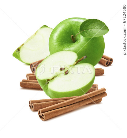 Green cooking apples and cinnamon sticks isolated Green cooking apples and cinnamon sticks isolated 67124580