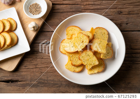 Thai Crispy Garlic Bread on white plate.Thai snack food Thai Crispy Garlic Bread on white plate.Thai snack food 67125293