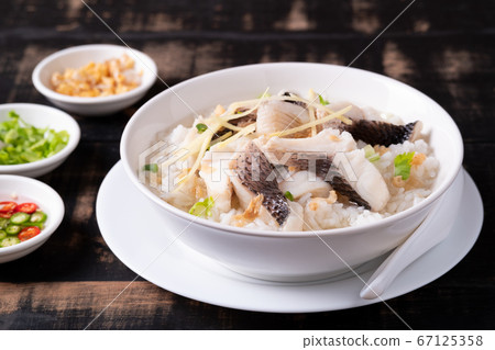 Fish Porridge,rice soup with sliced fish.Thai breakfast style Fish Porridge,rice soup with sliced fish.Thai breakfast style 67125358