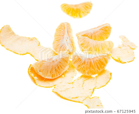 Peeled tangerine peel isolated on white background Peeled tangerine peel isolated on white background 67125945