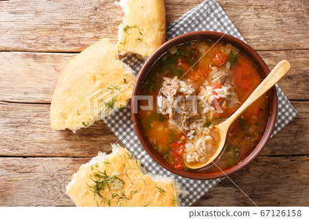 Kharcho soup in a bowl served with Georgian bread Kharcho soup in a bowl served with Georgian bread 67126158