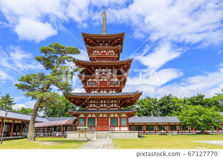Lotus flower blooming at World Heritage Yakushiji Temple after the restoration of the east tower 67127770