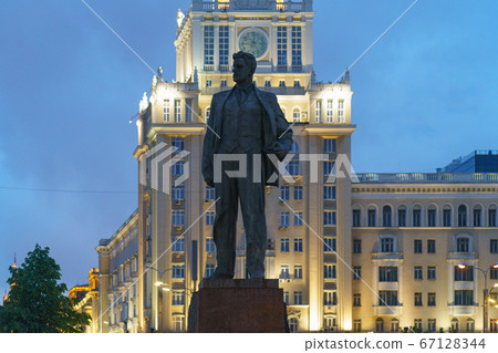 Photography of a bronze statue of soviet poet Vladimir Mayakovsky on the Triumfalnaya Square in Moscow. Literary heritage theme. Beautiful cityscape in summer night Photography of a bronze statue of soviet poet Vladimir Mayakovsky on the Triumfalnaya Square in Moscow. Literary heritage theme. Beautiful cityscape in summer night 67128344