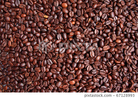 Fried Arabica brown coffee bean background or 67128993