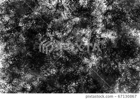 Dark painted overlay background  in black and white colors. Monochrome random stains of paint on paper. Creative backdrop 67130867