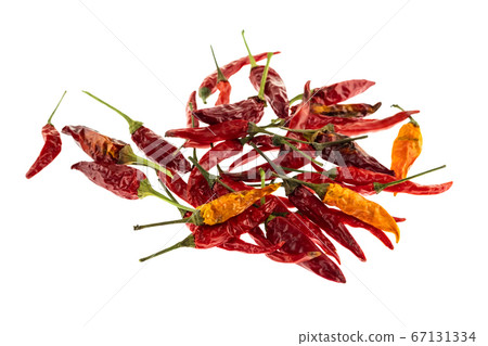 ripe hot red and orange chili peppers piled in a ripe hot red and orange chili peppers piled in a 67131334