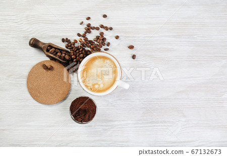 Coffee on light wood table 67132673
