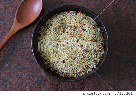 Couscous grains in tableware Couscous grains in tableware 67133201