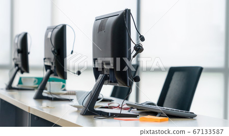 Call center computers and headsets all in office 67133587