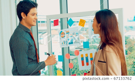 Business people work on project planning board 67133762