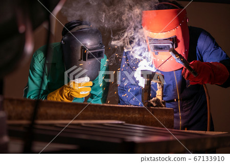 Metal welding steel works using electric arc welding machine 67133910