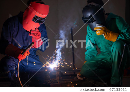 Metal welding steel works using electric arc welding machine 67133911