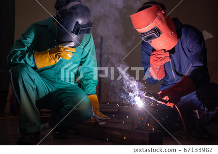 Metal welding steel works using electric arc welding machine 67133982