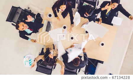 Successful business people celebrate together with joy Successful business people celebrate together with joy 67134228