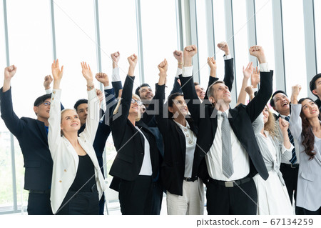 Successful business people standing together 67134259