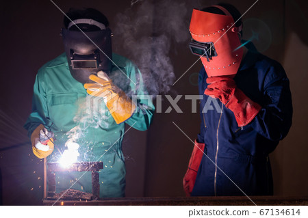 Metal welding steel works using electric arc welding machine Metal welding steel works using electric arc welding machine 67134614