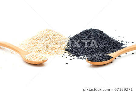 White and Black sesame seeds in wooden scoop on white background White and Black sesame seeds in wooden scoop on white background 67139271