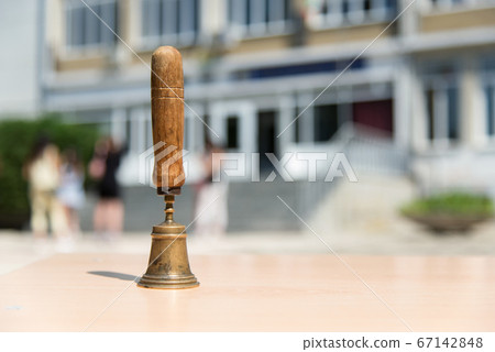An old school hand bell used to call students back 67142848
