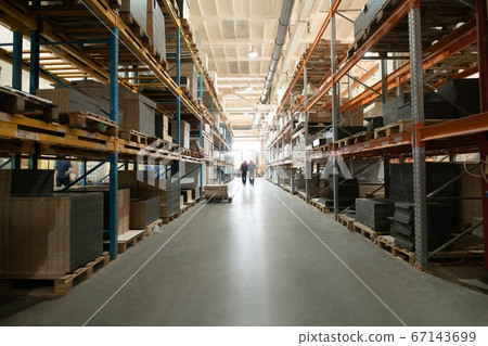 Unrecognizable workers walking in warehouse on factory Unrecognizable workers walking in warehouse on factory 67143699