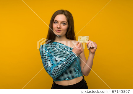 Photo of pleased young woman posing isolated over Photo of pleased young woman posing isolated over 67145807