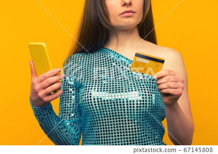 Lady buying online with a credit card and smart Lady buying online with a credit card and smart 67145808