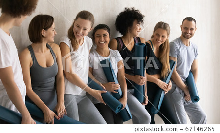 Excited young mixed race people enjoying friendly conversation. Excited young mixed race people enjoying friendly conversation. 67146265