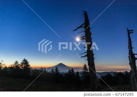 Shizuoka City Yamabushidake Moon and blue moment rising to Mt. Fuji at dawn 67147295
