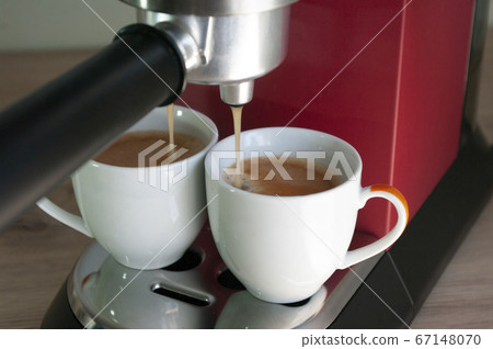 Two small cups with espresso coffee. Morning 67148070