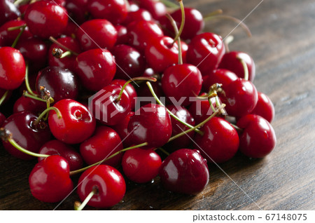 Fresh garden cherries on wooden table. Summer 67148075