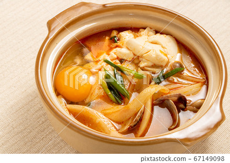 Tofu stew in a small pan. Tofu stew in a small pan. 67149098