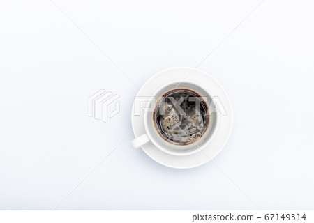 white cup with coffee on a white background with a place for text 67149314