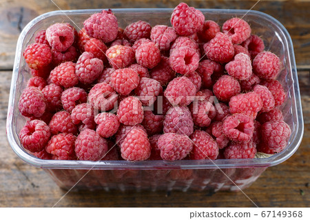 Fresh raspberries in store packaging. Fresh raspberries in store packaging. 67149368