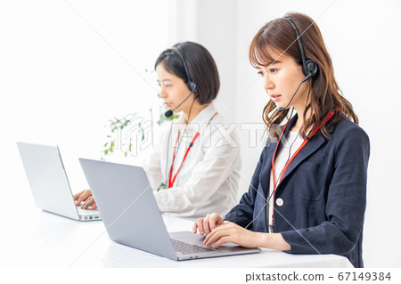 Call center woman serving customers 67149384