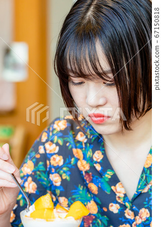 Woman eating parfait in cafe Woman eating parfait in cafe 67150818