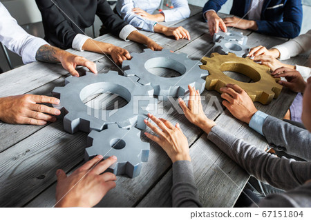 Business people joining gears Business people joining gears 67151804