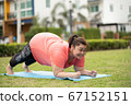 new normal concept,Young woman is happy to motivation exercise or yoga outdoor in the garden to control or lose weight.Obese fat woman have intention exercise to lose weight and build strong health. 67152151