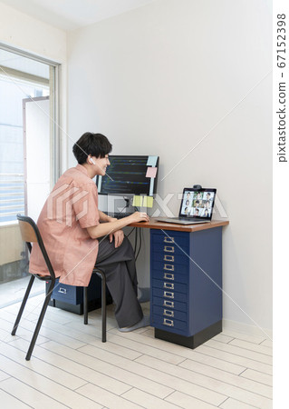 Image of a young male online meeting during telework Image of a young male online meeting during telework 67152398