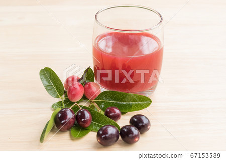 fresh Carissa carandas glass of juice with Carissa carandas fruits and Healthy drinks concept. 67153589