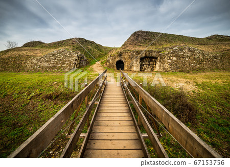 Old wooden bridge and ancient ruins in fortress-town Palmanova, Italy Old wooden bridge and ancient ruins in fortress-town Palmanova, Italy 67153756