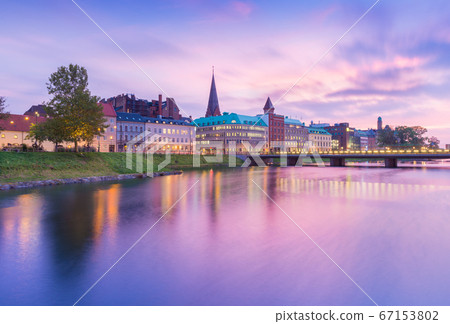 Beautiful sunset in Malmo, Sweden. Picturesque view of an old European city in the evening Beautiful sunset in Malmo, Sweden. Picturesque view of an old European city in the evening 67153802
