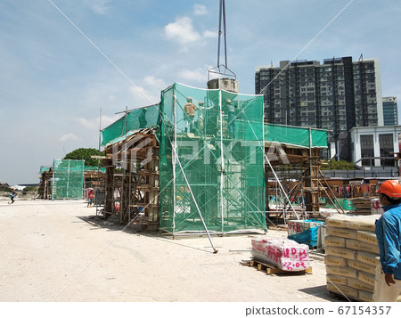 KUALA LUMPUR, MALAYSIA -JULY 29, 2019: Scaffolding is installed on the construction site as temporary support for high level construction. Installed according to specifications to ensure workers safet 67154357