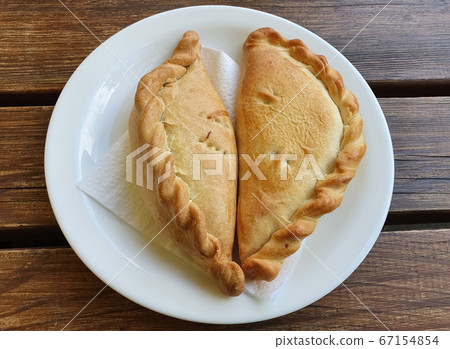 Karaite traditional food kibinai in Trakai Lithuania Europe. Wooden dark rustic background. Food 67154854