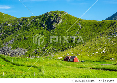 Mountains and farmstead on the Lofoten islands in Mountains and farmstead on the Lofoten islands in 67155066