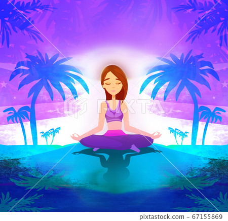 woman practicing yoga on the beach at sunset. 67155869