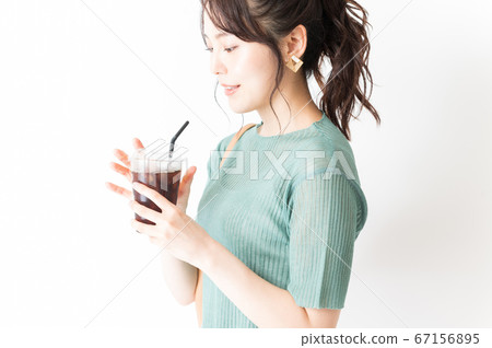 Office casual woman having ice coffee 67156895