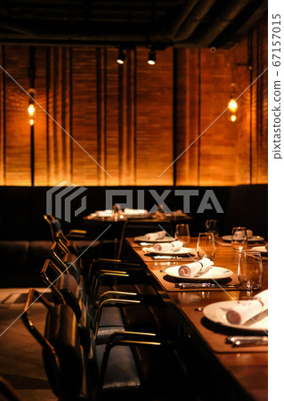 Seating inside the restaurant at night 67157015